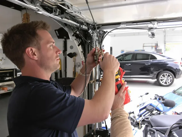 Sanford Garage Door Repair safety certified technician performing cable replacement in Sanford