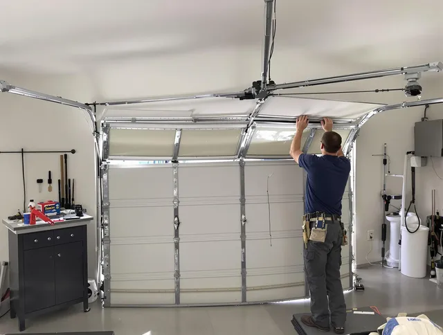 Sanford Garage Door Repair specialist performing precise section replacement on Sanford garage door